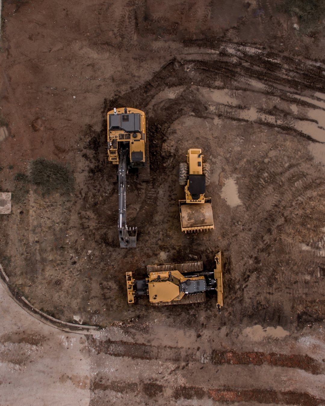 https://www.rakresourcesgroup.com/wp-content/uploads/2020/07/aerial-photo-of-excavator-road-roller-and-bulldozer-1579356-1.jpg